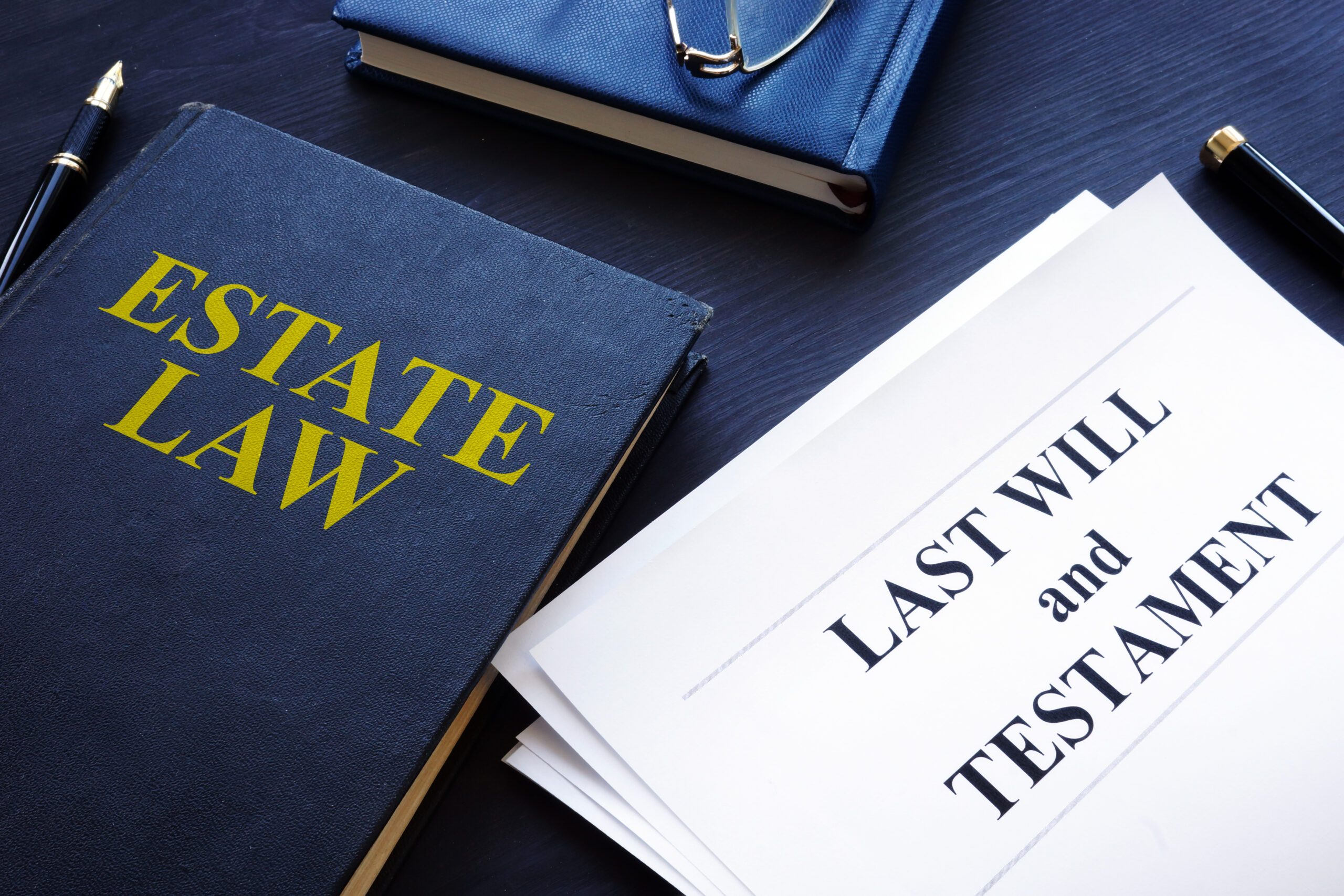 image showing a book about estate law and a last will and testament document