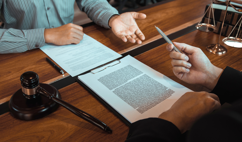 Lawyer discussing estate documents with a client during a letters of administration consultation.