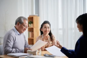 an elderly couple having a consultation with a lawyer regarding intestate succession act in Singapore
